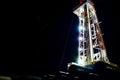 Oil and Gas Drilling Rig. Oil drilling rig operation on the oil platform in oil and gas industry. Beautiful night view of derrick