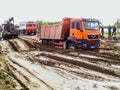 stuck truck in mud on a dirt road