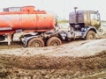 stuck truck in mud on a dirt road