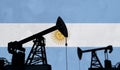 Oil and gas industry background. Oil pump silhouette against an argentina flag. 3D Rendering