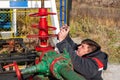 Oil, gas industry. A man photographs on a mobile phone the process of the oil pump close-up. A man near the oil pump