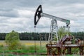 Oil and gas industry. Silhouette oil pumps on a sunset sky background. Toned.