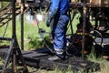 Oil and gas industry worker operates oil rig drill pipes on an oil well rig Royalty Free Stock Photo