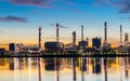 Oil and gas refinery industry plant with glitter lighting and sunrise in the morning, Factory of petroleum industrial Royalty Free Stock Photo