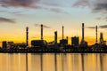 Oil and gas refinery industry plant with glitter lighting and sunrise in the morning, Factory of petroleum industrial, Royalty Free Stock Photo