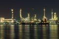 Oil and gas refinery at night time - Petrochemical factory Royalty Free Stock Photo