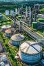 Oil and gas refinery with storage tanks and petrochemical factory infrastructure Royalty Free Stock Photo