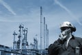 Oil and gas worker with refinery Royalty Free Stock Photo