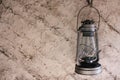 Oil lamp on the clay wall background Royalty Free Stock Photo