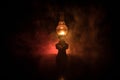 Oil Lamp Lighting up the Darkness or Burning kerosene lamp background, concept lighting. Selective focus