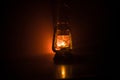 Oil Lamp Lighting up the Darkness or Burning kerosene lamp background, concept lighting. Selective focus