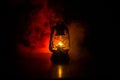 Oil Lamp Lighting up the Darkness or Burning kerosene lamp background, concept lighting. Selective focus