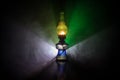 Oil Lamp Lighting up the Darkness or Burning kerosene lamp background, concept lighting. Selective focus