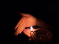 Diwali festival of lights, hand lighting an indian oil lamp Royalty Free Stock Photo