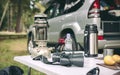 Oil lamp, thermos and binoculars over camping