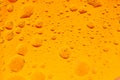 Oil mixed in water on a colorful yellow orange and golden background. Photographed in close up with shallow DOF.Photo taken: Royalty Free Stock Photo