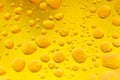 Oil mixed in water on a colorful yellow orange and golden background. Photographed in close up with shallow DOF.Photo taken: Royalty Free Stock Photo