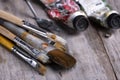 Oil paint brushes and tubes on wood Royalty Free Stock Photo