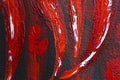 Oil painting red hot chili peppers on canvas. Piece of red chili peppers. Black and red. Oil paints. Close-up. Macro. Copy space.