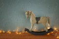 Oil painting style illustration of vintage rocking horse on wooden floor Royalty Free Stock Photo