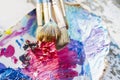 Oil paints and brushes on the old wooden table Royalty Free Stock Photo