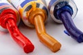 Oil paints squeezed out of a tube are ultra blue, red and ochre colors. Royalty Free Stock Photo