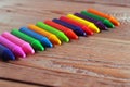 Oil pastel crayons lying on a wooden table Royalty Free Stock Photo