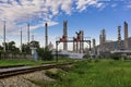 Oil and petroleum industry zone and blue cloud white background with railroad foreground Royalty Free Stock Photo