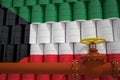 Oil pipe and barrels with painted flag of Kuwait. Petroleum industry related 3d rendering