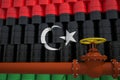Oil pipe and barrels with painted flag of Libya. Petroleum industry related 3d rendering