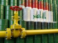 Oil pipe line valve in front of the flag of Iraq on the oil barr Royalty Free Stock Photo