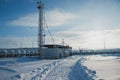 White tanks in tank farm with iron staircase in snow Royalty Free Stock Photo