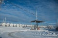 White tanks in tank farm with iron staircase in snow Royalty Free Stock Photo