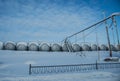 White tanks in tank farm with iron staircase in snow Royalty Free Stock Photo
