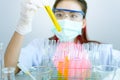 Young Asian scientist with test tube making research in clinical laboratory.Science, chemistry, technology, biology and people con Royalty Free Stock Photo