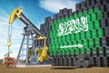 Oil production and extraction in Saudi Arabia. Oil pump jack and oil barrels with Saudi Arabia flag