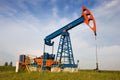 An oil pump jack Royalty Free Stock Photo