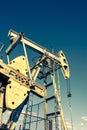 Oil pumpjack, industrial equipment. Rocking machines for power genertion. Extraction of oil. Royalty Free Stock Photo