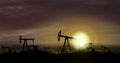Oil pumps - oil extraction on sunset background
