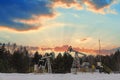 Oil pumps. Russia Oil industry equipment. Oil rig energy industrial machine for petroleum crude. Oil crisis. Fiery red clouds from Royalty Free Stock Photo