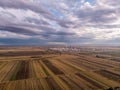 Oil rafinery in the middle of the agriculture corn fields. Health concept with industry object where food is producing Royalty Free Stock Photo