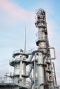 Oil refinery chemical plant vertical bottom view with copy space over evening sky background