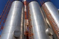 Oil Refinery Exterior with Storage Tanks Over Blue Sky Background Royalty Free Stock Photo