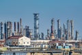 Oil refinery industry view details of pipes with valves in a large refinery isolated on blue sky Royalty Free Stock Photo