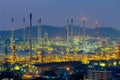 Oil refinery light nigh view with mountain Royalty Free Stock Photo