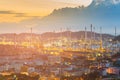 Oil refinery with mountain with after sunset sky background Royalty Free Stock Photo