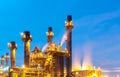 Oil refinery, petroleum and energy plant at twilight with sky background. Royalty Free Stock Photo