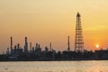 Oil refinery plant in industry estate against sun rising in morning Royalty Free Stock Photo