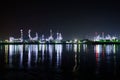 Oil refinery at the river in night time Royalty Free Stock Photo