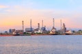 Oil refinery at the river in sunset time Royalty Free Stock Photo